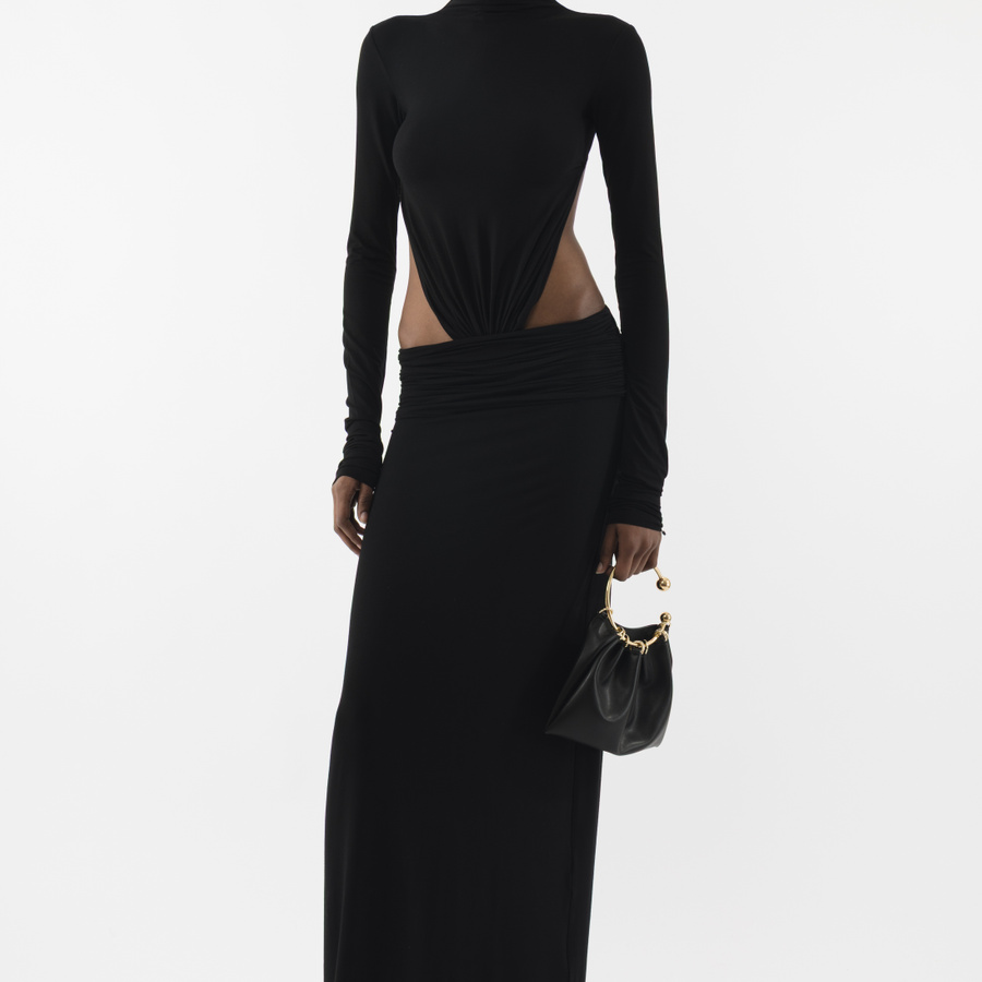 The Jersey Maxi Dress offers a perfect blend of comfort and elegance,  crafted from ultra-soft jersey fabric for a sleek, figure-hugging fit. The  long-sleeve turtleneck top connects to the skirt with gathered